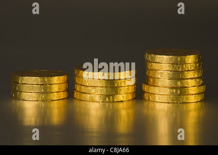 Gold coloured artificial coins, chocolate coins Stock Photo