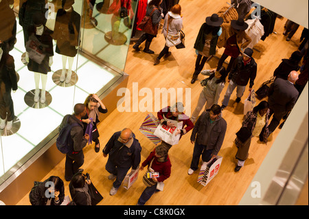 Customers shop at the grand opening of the Uniqlo store on West 34th street in New York Stock Photo