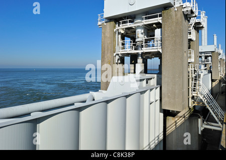 Storm flood barrier / Oosterscheldekering / Eastern Scheldt storm surge barrier, part of the Delta Works in the Netherlands Stock Photo