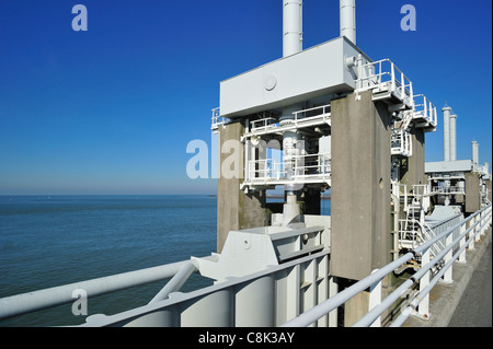 Storm flood barrier / Oosterscheldekering / Eastern Scheldt storm surge barrier, part of the Delta Works in the Netherlands Stock Photo