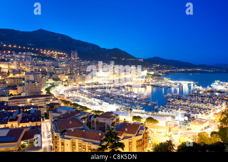 Dusk view of Port Hercule and the city and Principality of Monaco on the French Riviera along the Mediterranean coast. Stock Photo