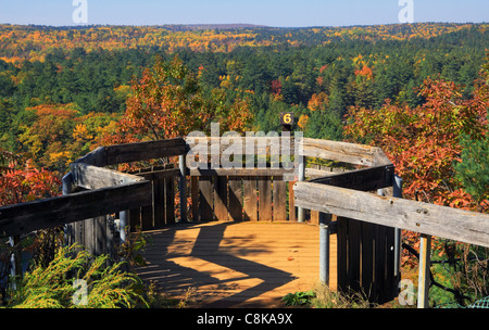 Lookout in Bon Echo Provincial Park with vast forest in brilliant fall color in the background Stock Photo