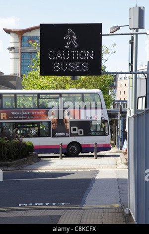 Bus Warning Sign to pedestrians, UK Stock Photo