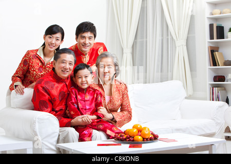 Grandchildren and grandmother with Chinese New Year paper-cut Stock