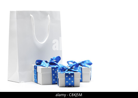 Gift bag and gift boxes isolated on white.. Stock Photo