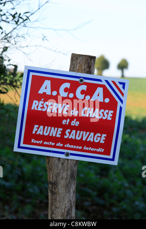 Faune Sign French sign for Reserve de Chasse et de Faune sauvage nailed to a tree ...