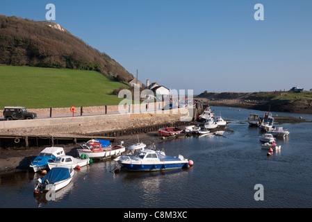 Seaton Harbour with boats moored, River Axe estuary, Devon, England, UK Stock Photo