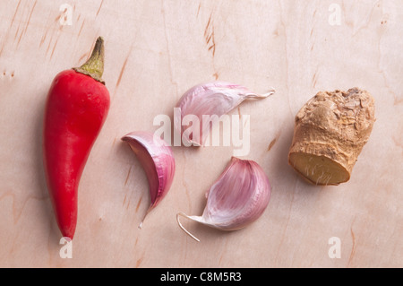 A mixture of spices (red chili, garlic and ginger). Stock Photo