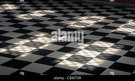 dirty black and white tiled dance floor Stock Photo