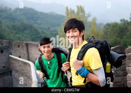 Young people go hiking on the Great Wall Stock Photo