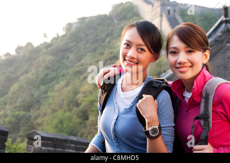 Young people go hiking on the Great Wall Stock Photo