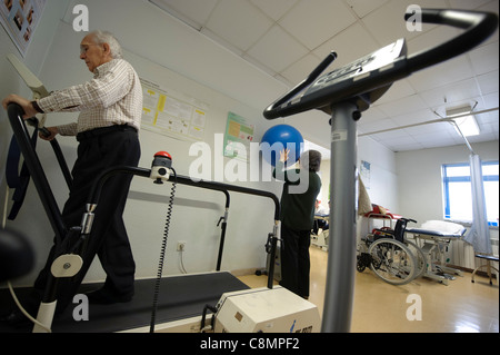 Elderly people exercising at hospital's physical rehabilitation gymn Stock Photo