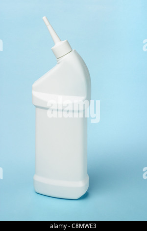 Plastic bottle of toilet bowl cleaning product on blue background Stock Photo