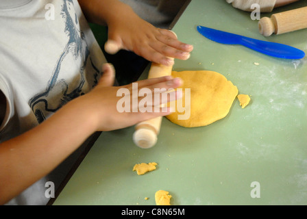 Child playing with playdough Stock Photo