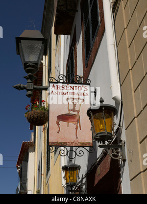 Street lamps and shop store sign on building in the old town Funchal Madeira Portugal EU Europe Stock Photo