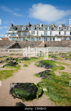 Great Britain, Scotland, Fife, Lower Largo, Beach at low tide and seafront houses Stock Photo