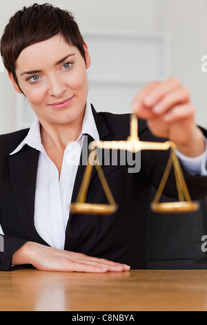 Woman holding the justice scale Stock Photo