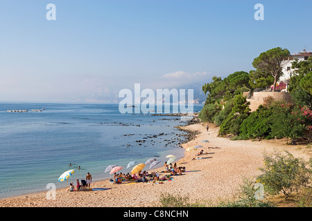 Italy, Sardinia, Cala Ganone, view of beach with Golfo di Orosei coastline beyond, morning Stock Photo