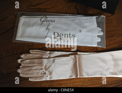 Glamorous long sleeved gloves and cream pair from Dents as worn in the fifties and sixties era fashion Stock Photo