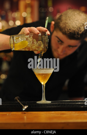 Barman making cocktails at the Twisted lemon cocktail bar and restaurant in Brighton UK Stock Photo