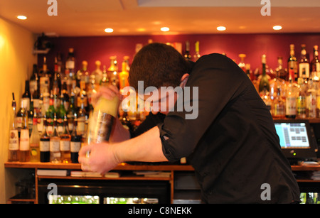 Barman making cocktails at the Twisted lemon cocktail bar and restaurant in Brighton UK Stock Photo