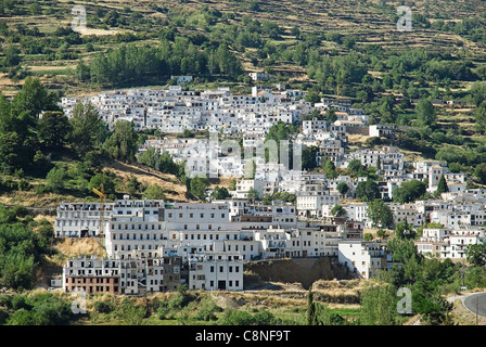 Spain, Andalucia, Alpujarras, Trevelez, Village of white houses nestled on side of a hill Stock Photo