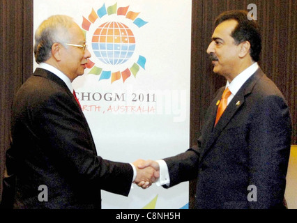 Pakistan Prime Minister, Syed Yousuf Raza Gilani shakes hand with his Malaysian counterpart Stock Photo