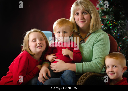 Christmas Family Portrait - A mother with her children Stock Photo