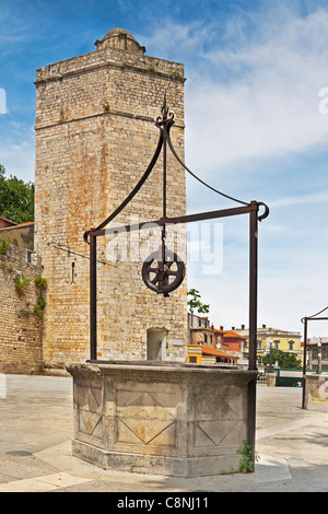 One well in front of the city wall and the Captain's tower at Five Wells Square, Zadar, Dalmatia, Croatia, Europe Stock Photo