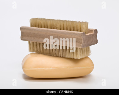a piece of soap, on it is a Nailbrush Stock Photo