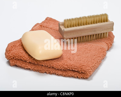 Detail photo of a Nailbrush a piece of soap and a hand towel Stock Photo