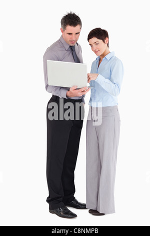 Office workers using a laptop Stock Photo