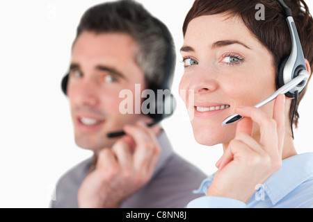 Close up of switchboard operator speaking through headsets Stock Photo