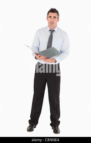 Businessman holding a binder Stock Photo