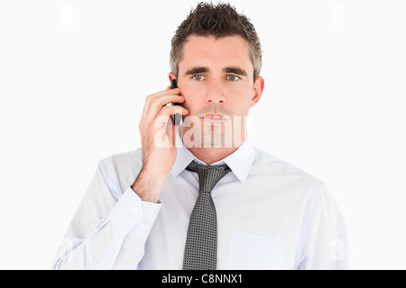 Unhappy man making a phone call Stock Photo