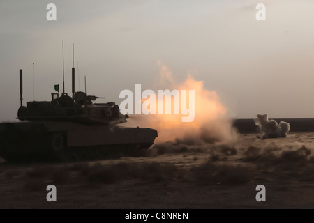 CAMP LEATHERNECK, Helmand province, Islamic Republic of Afghanistan – Marines with Delta Company, 1st Tank Battalion, 1st Marine Division (Forward), fires the main cannon of an M1A1 Abrams tank during a range at Camp Leatherneck, Jan. 13, 2011. The Marines fired multiple rounds to align their sights and prepare their tanks for upcoming missions. Stock Photo