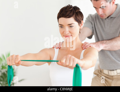 Patient doing some special exercises under supervision Stock Photo