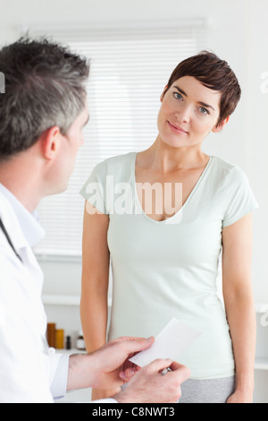 Close up of a smiling Woman receiving a prescription Stock Photo