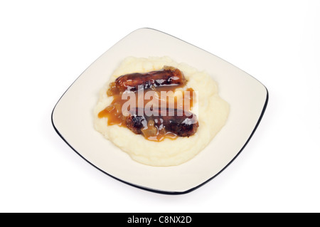 Bangers and mash on white plate on white background cutout. Stock Photo