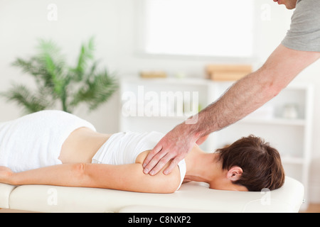 Masseur massaging woman's back Stock Photo - Alamy