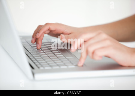 Hands typing on keyboard Stock Photo