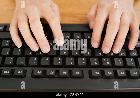 Typing woman on keyboard Stock Photo
