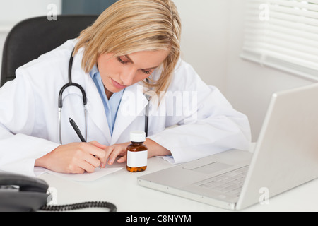 Doctor writing something down Stock Photo