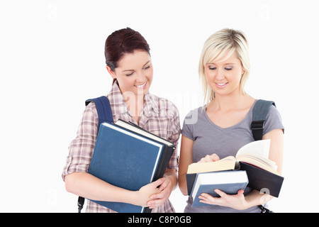 Female students reading a book Stock Photo