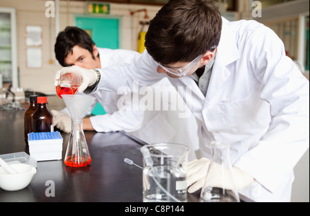 Students making an experiment Stock Photo
