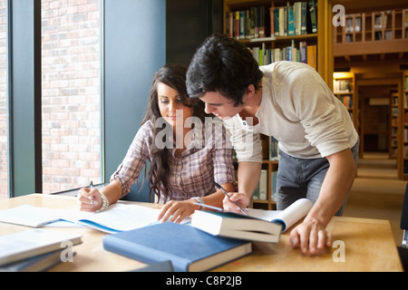 Two students working together Stock Photo