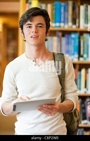 Portrait of a serious student holding a tablet computer Portrait of a serious student holding a tablet computer