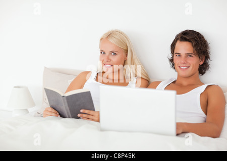 Young couple in their bed Stock Photo