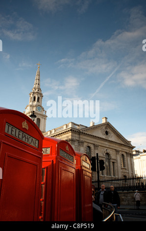Classic red telephone boxes in front of St. Martin-in-the-Fields, London Stock Photo