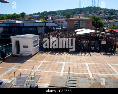 Crowds waiting for ferry from Princes Islands to Istanbul on a summer afternoon Stock Photo